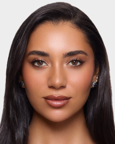 Woman with long black hair wearing Dimple Color's Acacia Olive color contact lenses