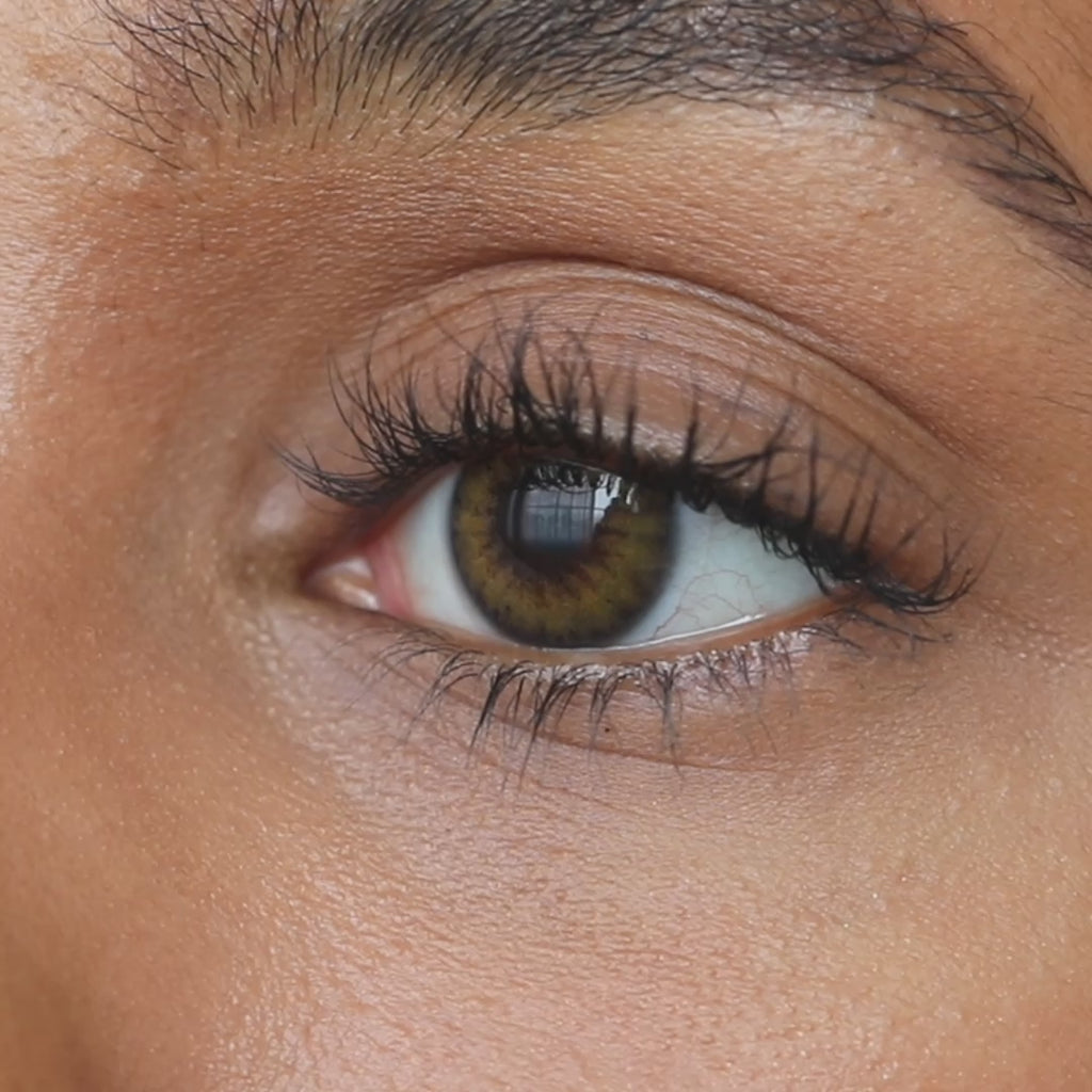 Close up of an eye wearing Dimple Color's Savanna Hazel color contact lenses